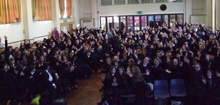 I'm the tiny one in the middle, wearing the same colour as the school uniform! (note to self: next time wear RED!)