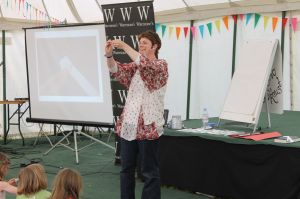 Me demonstrating the folding technique in a wish star - you can see the powerpoint image on the screen to the left