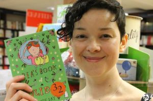 Susie with her shiny new book, Pea's Book of Holidays