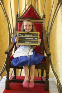 Jemima, dressed as Alice, with her first choice of words