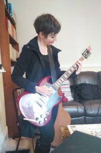 Helen Stickland on electric guitar
