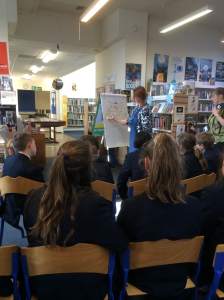 Cathy drawing a dog wearing a bra, on a tractor, eating grass. Because of course!